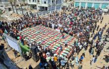 تشييع جثامين 112 شهيدًا من عائلة أبو شريعة والحساينة في واحدة من أفظع المجازر التي ارتكبها الاحتلال أثناء حرب الإبادة على غزة (أرشيفية)