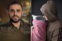 عبد الله سمير الكحلوت (يمين) حاملاً مولوده الجديد الذي اختار له اسم شقيقه