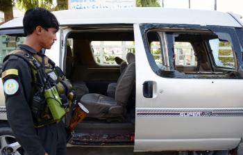 السيارة التي كانت تقل النساء العاملات في المطار - (أ ف ب)