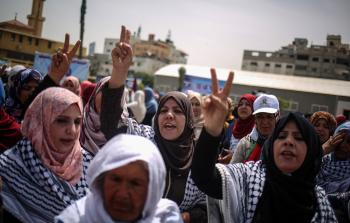 جانب من مسيرة في غزة بمناسبة يوم العمال (الأناضول)