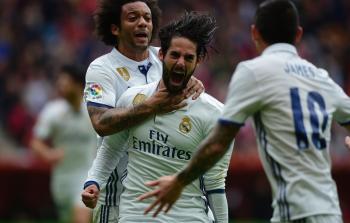 ايسكو بعد تسجيله الهدف الثالث لريال مدريد (أ ف ب)