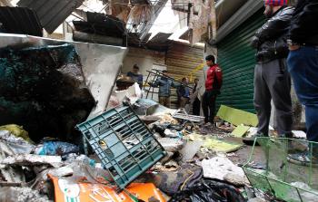 جانب من الدمار الذي أحدثه الهجوم التفجيري المزدوج في بغداد اليوم (أ ف ب)