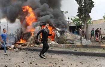 جانب من مكان التفجير في إعزاز السورية (أ ف ب)