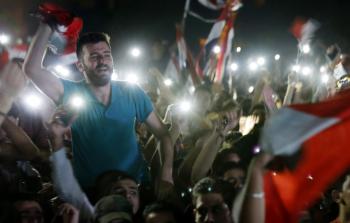 جانب من احتفال المواطنين السوريين أمس - (أ ف ب)