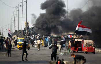 مشاهد من احتجاجات اليوم في العراق (الفرنسية)