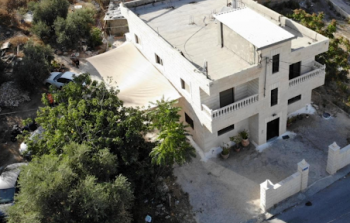 منزل عائلة عليان قبل الهدم (وكالات)