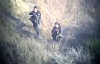 مقاتلان من كتائب القسام في زيكيم