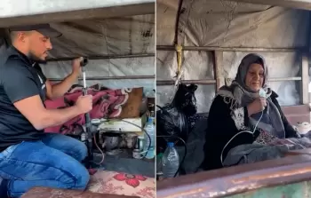 تحاول الأم المسنة التقاط أنفاسها بصعوبة، بينما يراقبها نجلها بعينين مثقلتين بالعجز والخوف