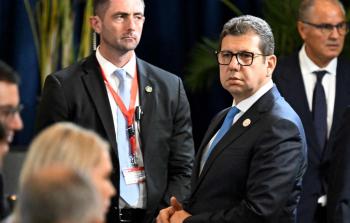 اللواء حسن رشاد (يمين) خلال شرم الشيخ للسلام في 13 أكتوبر 2025