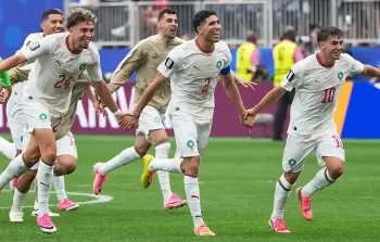 فرحة لاعبي المغرب عقب الفوز على كندا والتأهل لربع نهائي المونديال